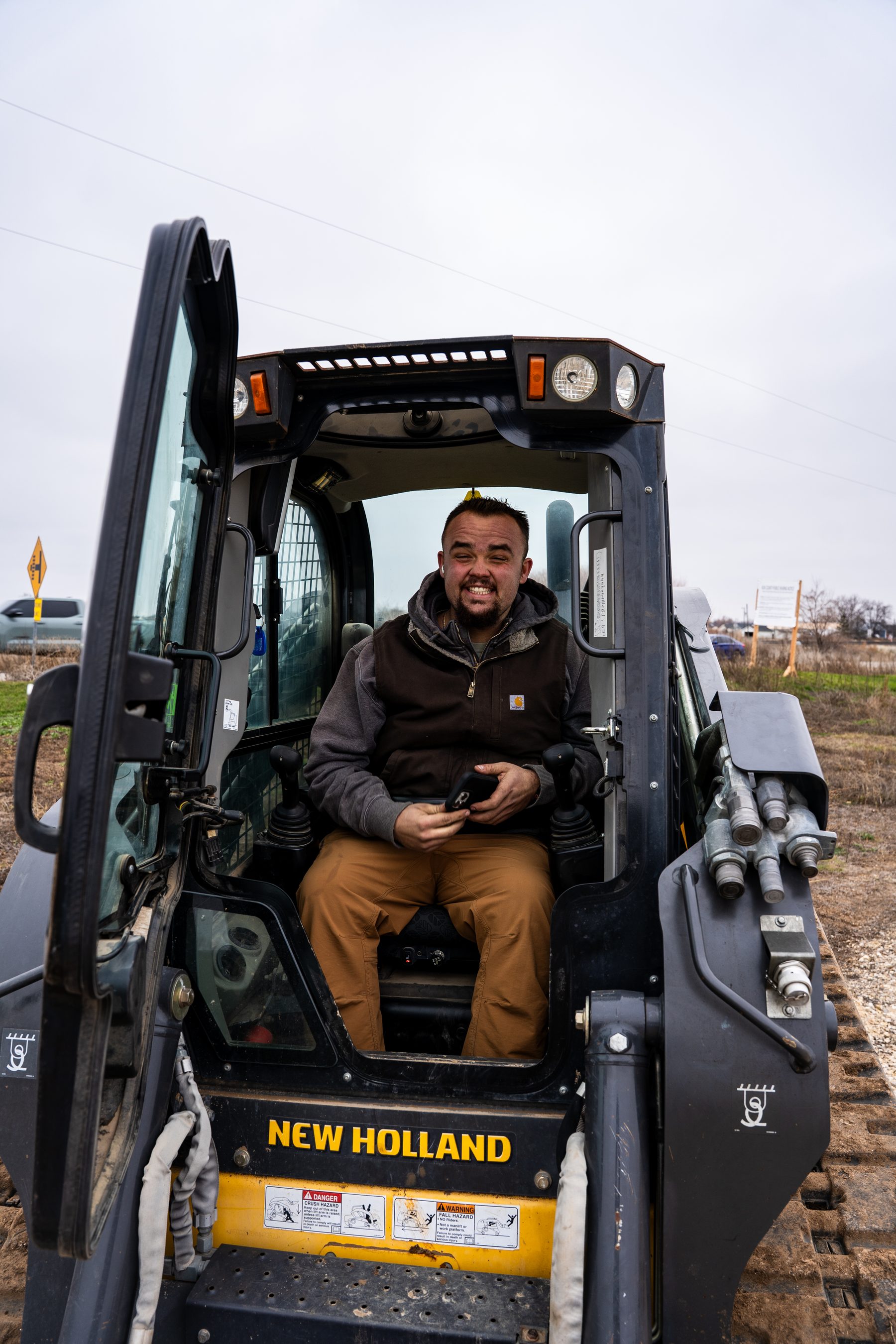 Ollan Stinar operating a compact track loader on a jobsite.